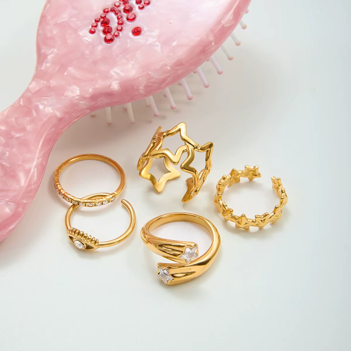 Anillo dorado de ojo turco con piedra zirconia azul, de tipo ajustable.