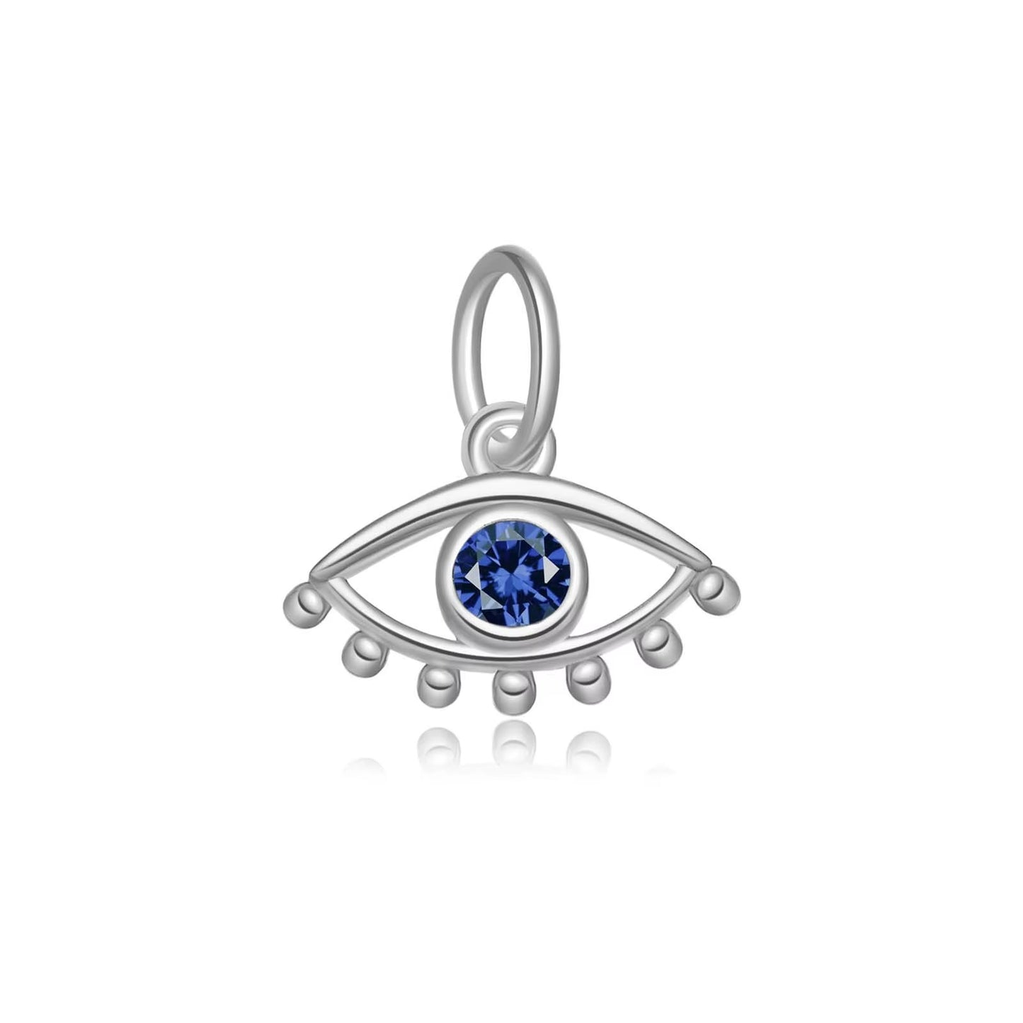 Dije mini plateado de ojo turco, con piedra zirconia en color azul.