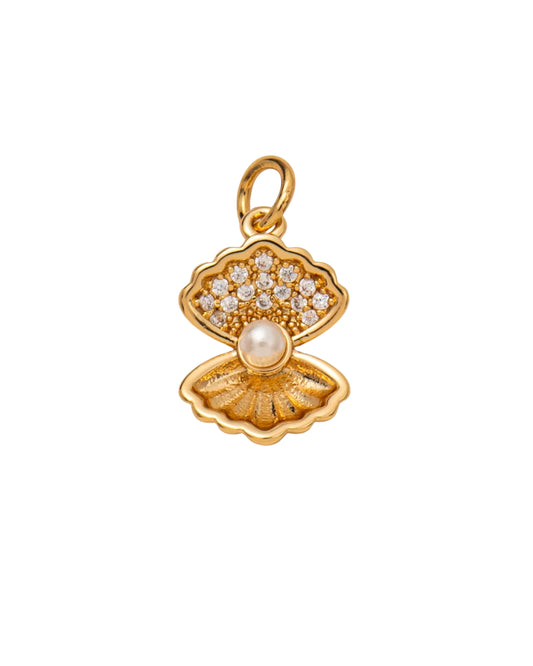 Dije de concha marina dorada con pavé de cristales y perla central