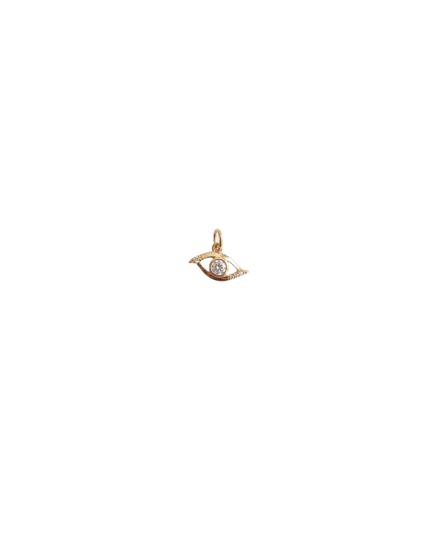 Dije de ojo protector con pavé de cristales y centro brillante en dorado