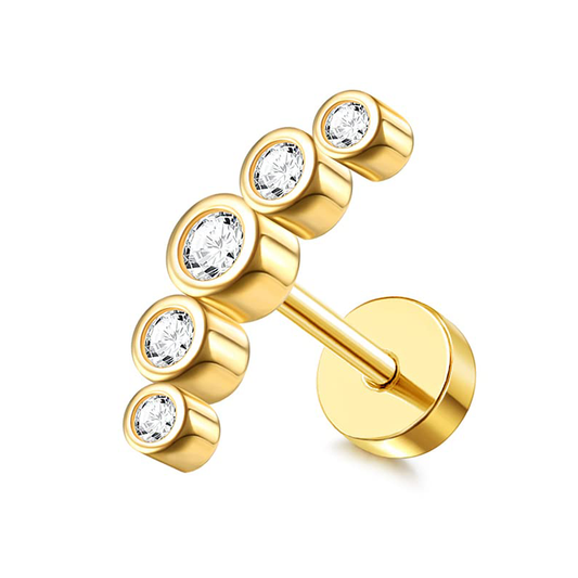 Estos aretes combinan una silueta minimalista en dorado con cinco zirconias que reflejan la luz con cada movimiento. Su diseño curvo aporta un toque moderno y elegante. Atemporales y versátiles, son el accesorio ideal para elevar cualquier look con un brillo sutil y sofisticado