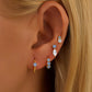 Conjunto de aretes con piedra zirconia en color azul, tipo huggie y studs