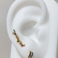 Arete dorado elegante con piedra circonias en distintos colores tipo ear climbers
