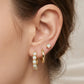 Conjunto de aretes con piedra circonia en color opalo