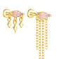 Aretes asimétricos con cristales rosados y cadenas de flecos dorados