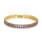 Pulsera dorada estilo tennis con circonias moradas