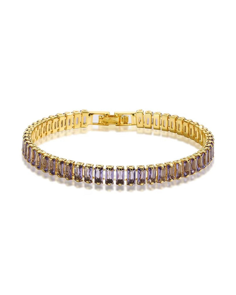 Pulsera dorada estilo tennis con circonias moradas