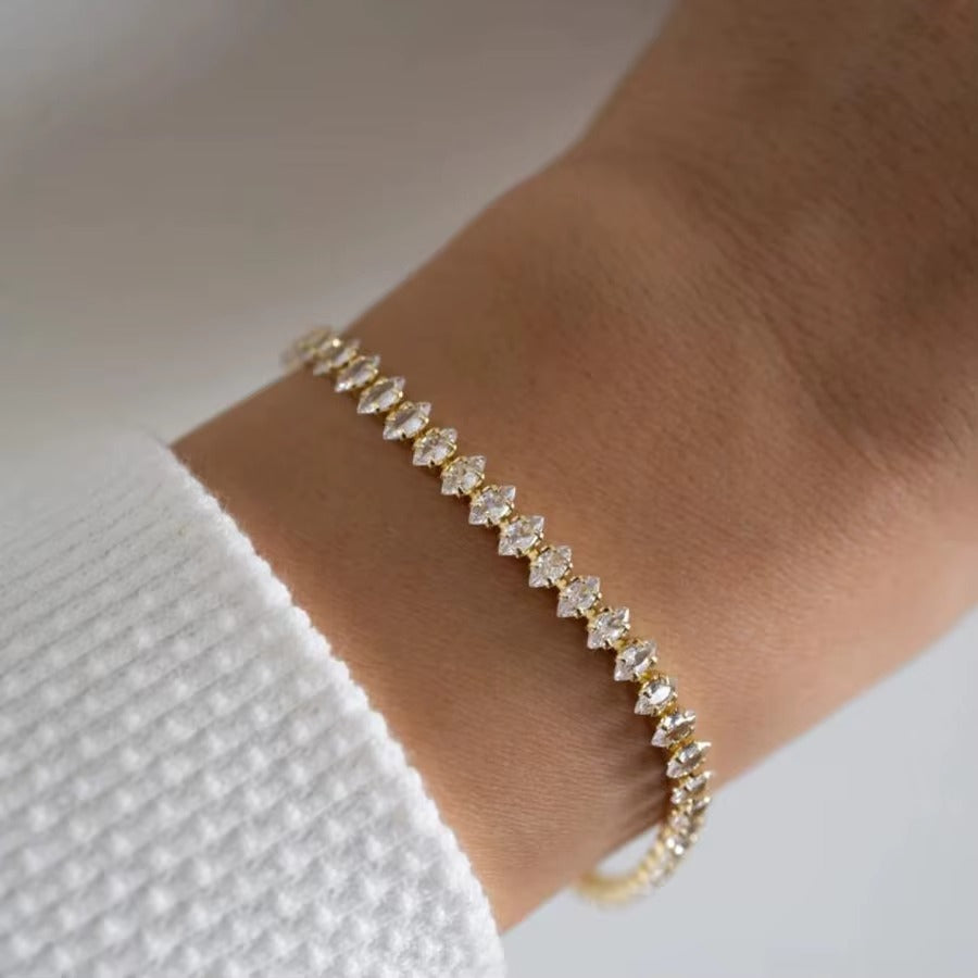 Pulsera tipo tennis de chapa de oro con circonias cafes
