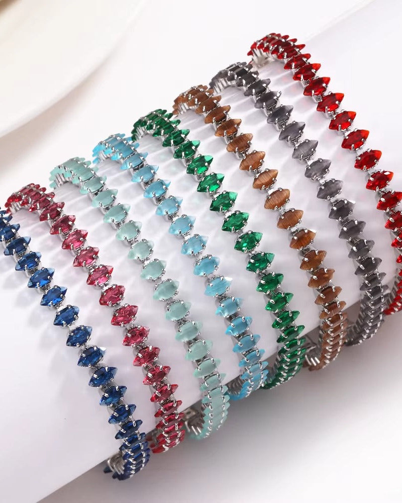 Pulsera estilo tennis de chapa de oro con zirconias rojas