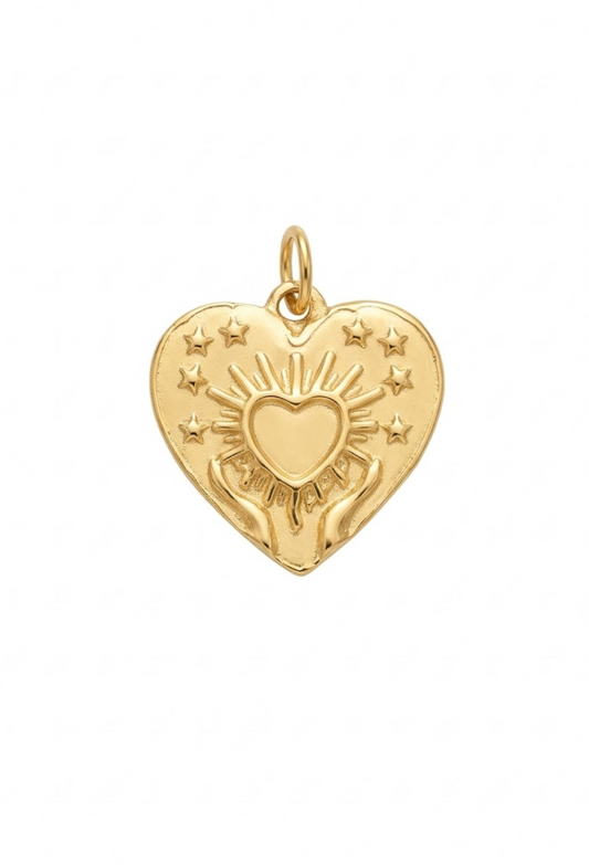 Dije medallón corazón sagrado con ráfagas de luz y estrellas