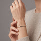 Pulsera articulada tricolor con detalles de circonias en oro 10K
