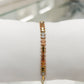 Pulsera articulada tricolor con detalles de circonias en oro 10K