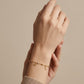 Pulsera de cadena fina con estrella, infinito y esferas en oro 10K