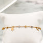 Pulsera de cadena fina con estrella, infinito y esferas en oro 10K