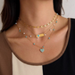 Collar dorado de corazón en color turquesa, de tipo ajustable