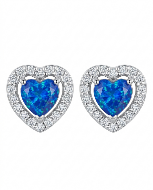 Aretes tipo studs de corazón con cristal azul y halo de circonias