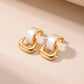 Aretes tipo studs con aros entrelazados en dorado y blanco