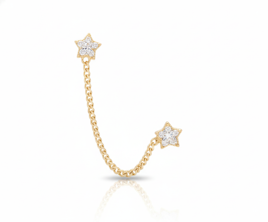 Arete de estrella con zirconia, de tipo piercing colgante, elaborado en oro de 10K.
