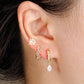 Conjunto de aretes de zirconia en colores azul y rosa, tipo huggie y studs