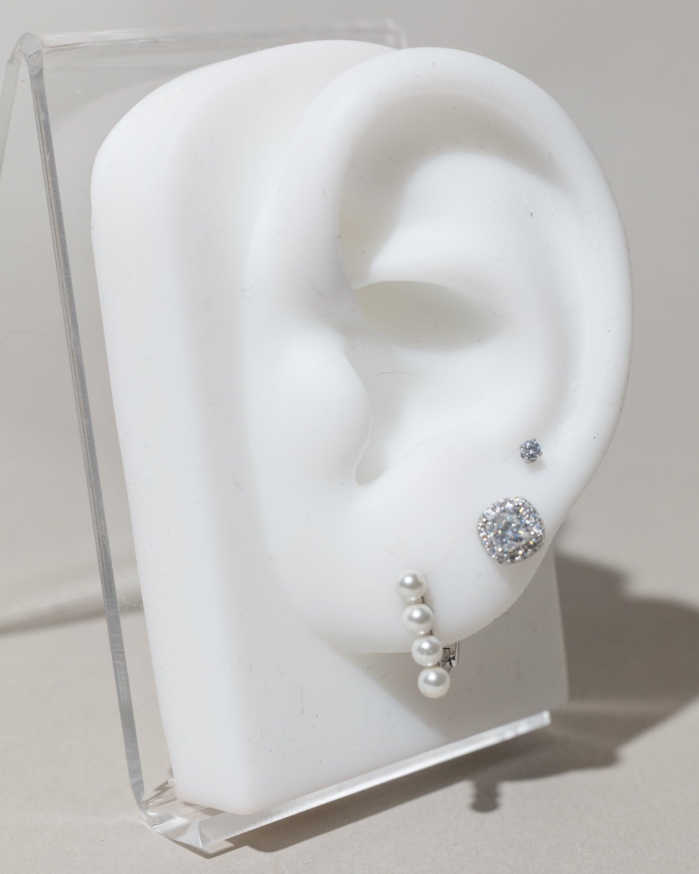 Broqueles de circonia central con halo de micro-pavé en plata