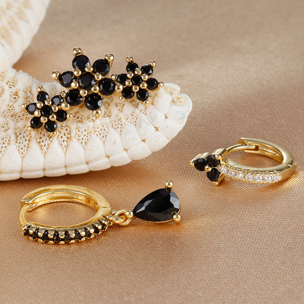 Conjunto de aretes de zirconia color negro tipo huggie y studs