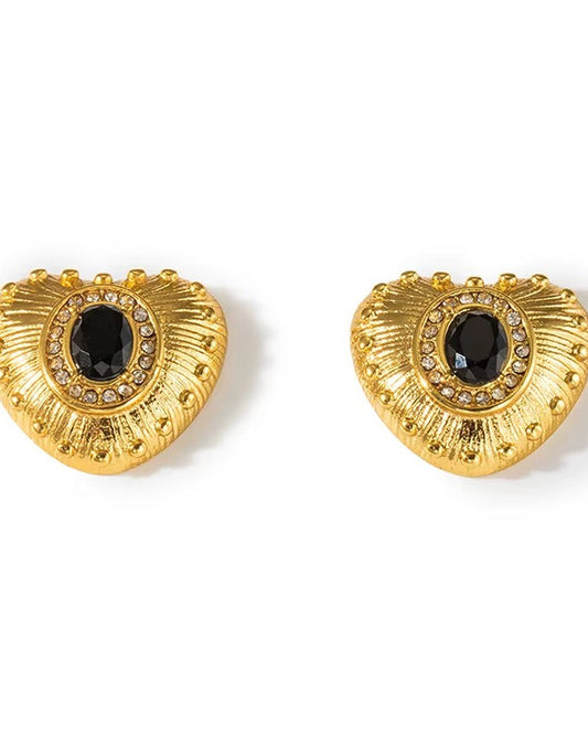 Aretes tipo studs, de corazon, color negro y dorado