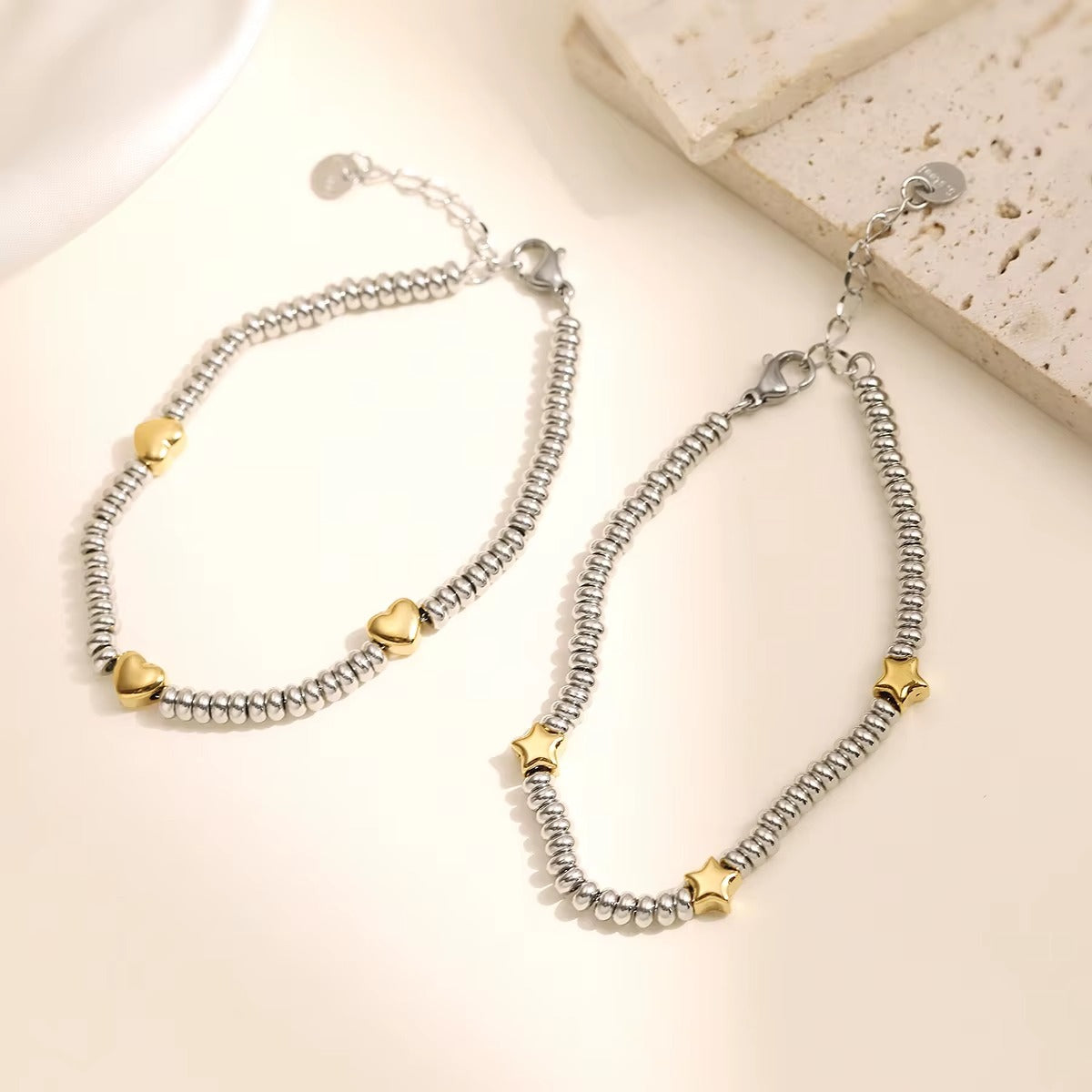 Pulsera con diseño de estrellas, bicolor dorado y plateado
