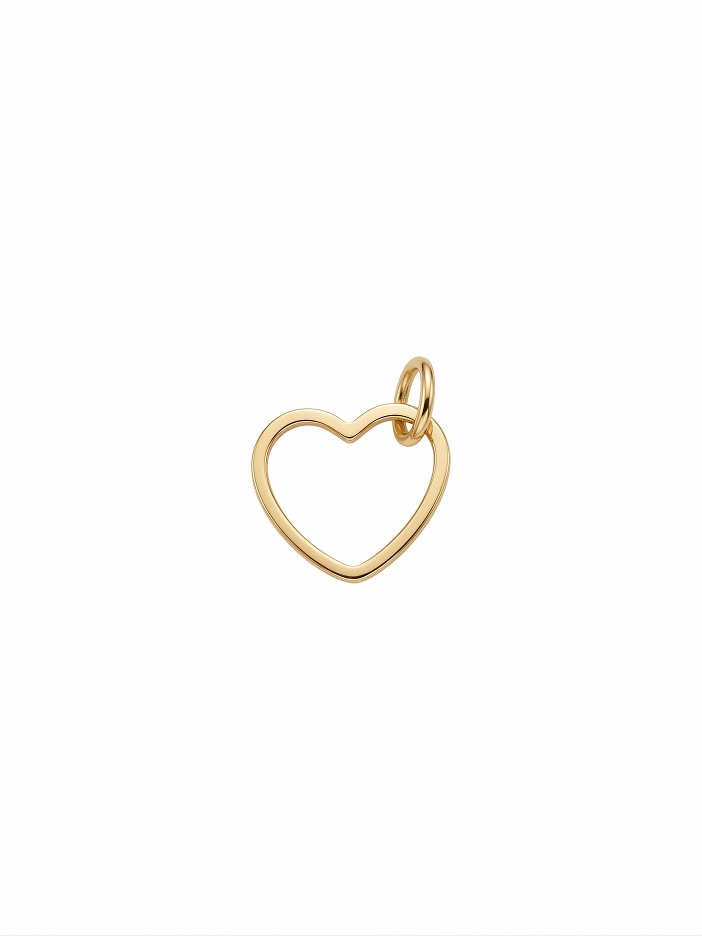 Dije de corazón con silueta estilizada en dorado