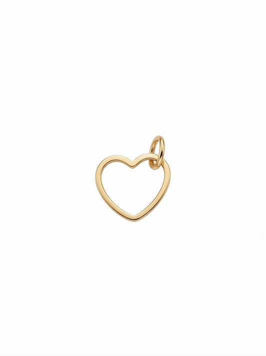 Dije de corazón con silueta estilizada en dorado