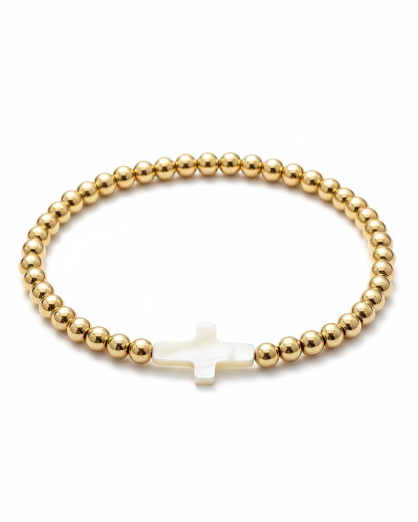 Pulsera dorada con diseño de cruz en perla