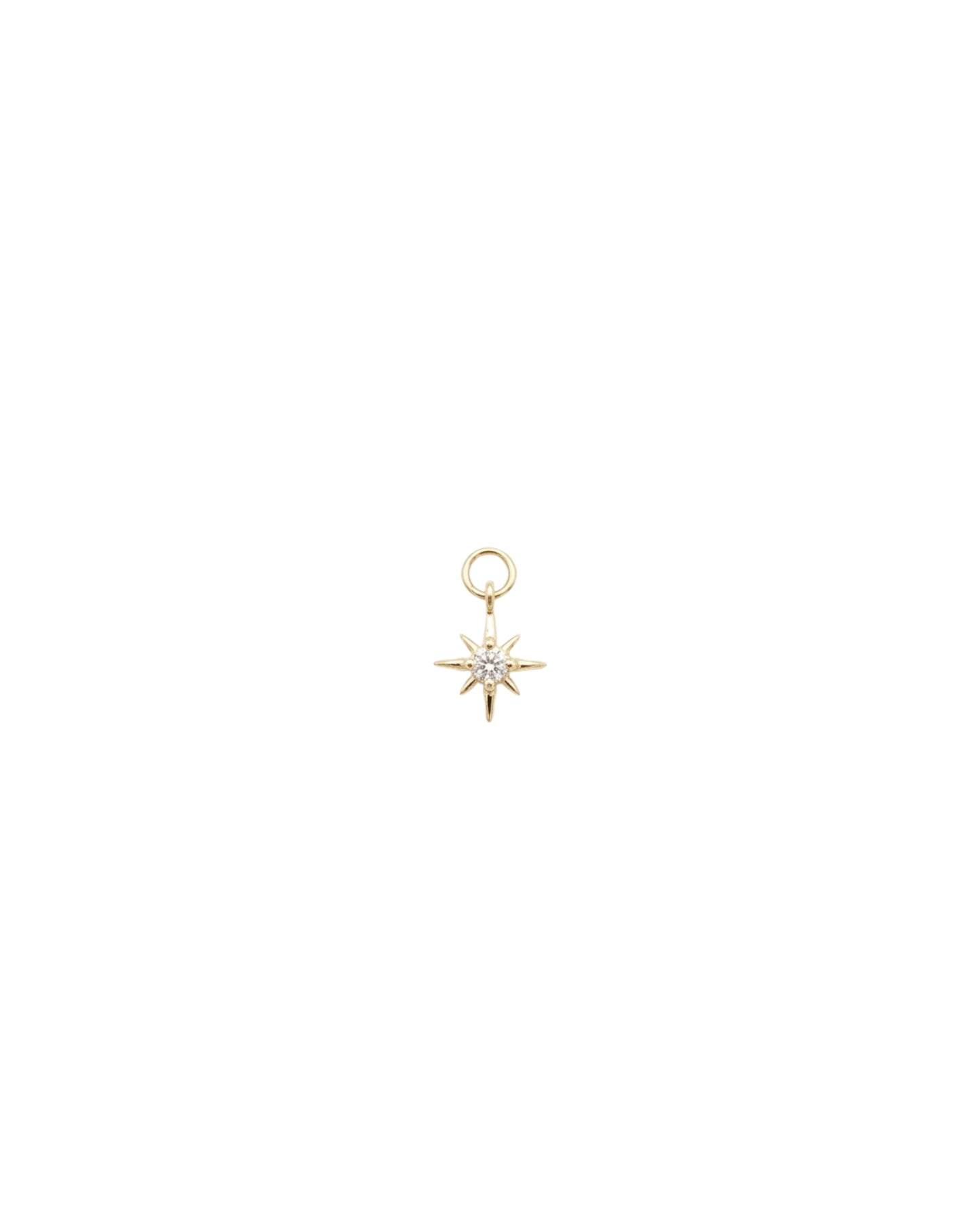 Dije de estrella del norte con cristal central en dorado