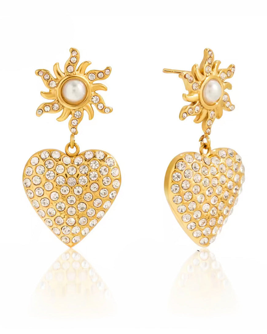 Aretes corazón radiante con sol de perla y cristales