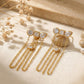 Aretes triple gala con cristales geométricos y cascada de cadenas