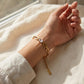 Pulsera de eslabones ovalados con circonia esmeralda en relieve