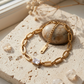 Pulsera de eslabones ovalados con circonia esmeralda en relieve
