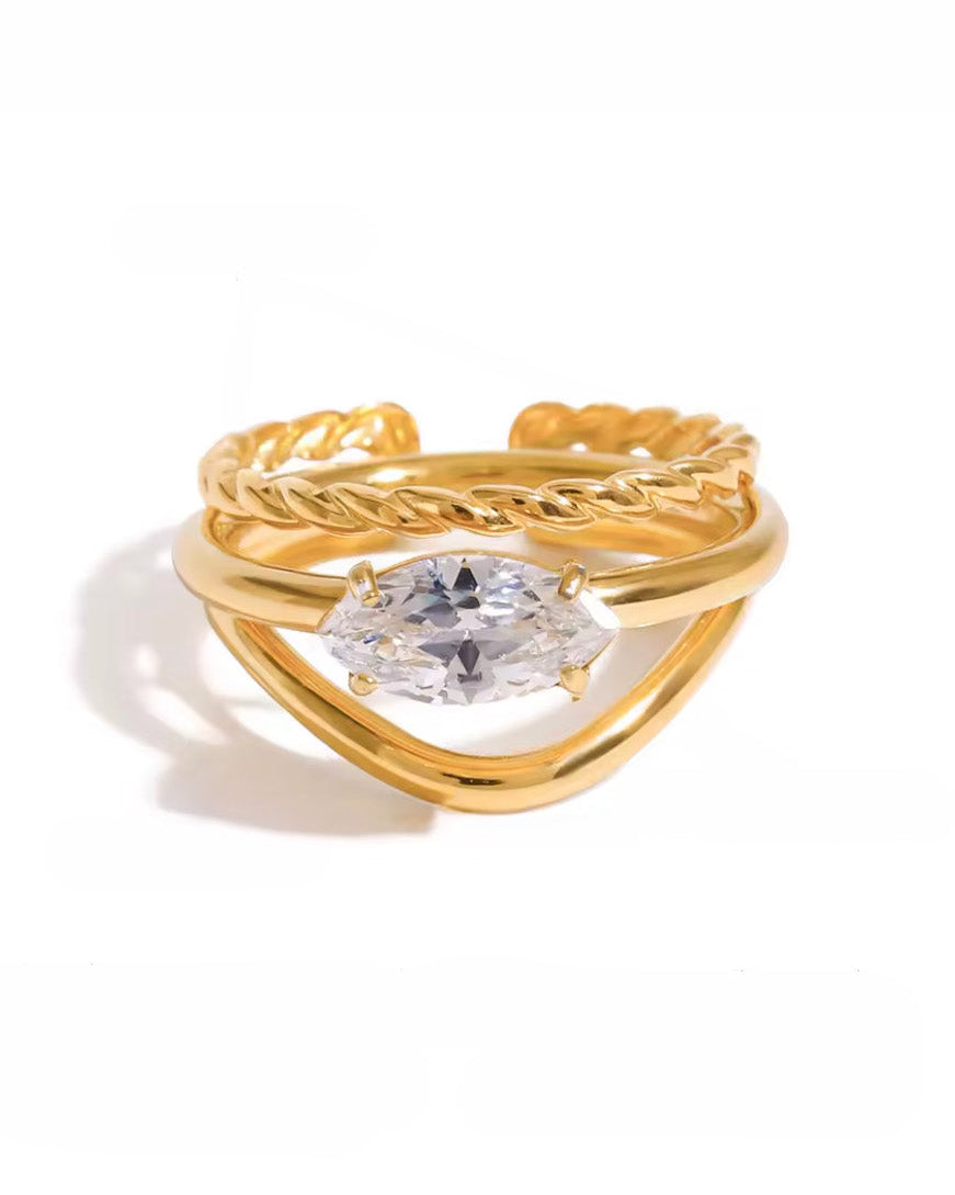 Anillo triple con circonia marquesa y textura torzal