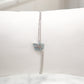 Pulsera de doble cadena con detalle de caracol y deposito de color azul mar y plata
