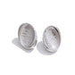 Aretes Plateados Ovalados con Textura de Ola