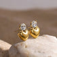 Aretes dorados de corazon con piedra brillante