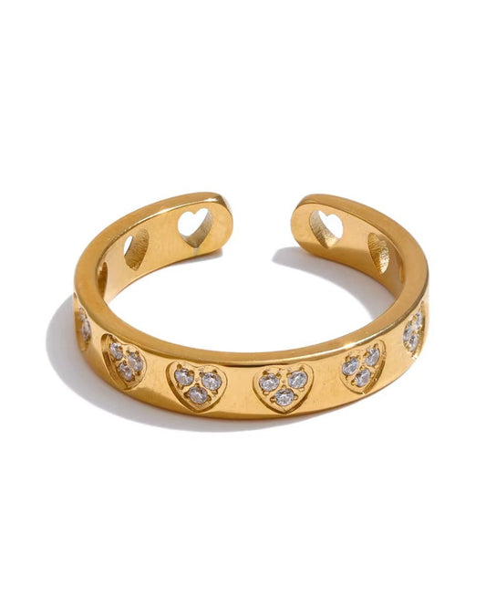 Anillo ajustable con diseño de corazones y zirconias, color dorado