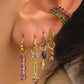 Arete statement de flores con piedras en color rosa, de tipo drop