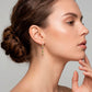 Arete statement de flores con piedras en color rosa, de tipo drop