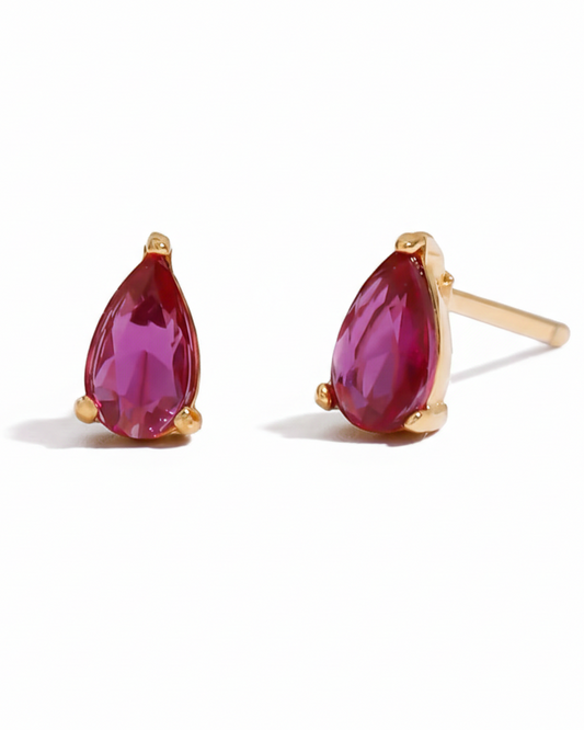 Aretes con cristal rosa tipo studs, color dorado