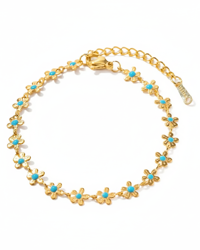 Pulsera de flores en color dorado y turquesa.