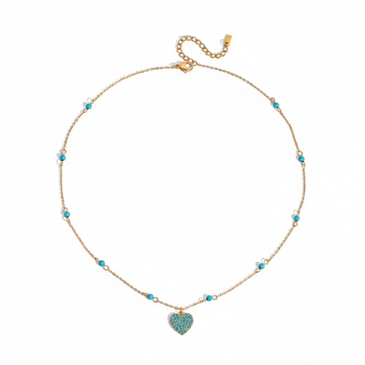Collar dorado de corazón en color turquesa, de tipo ajustable.